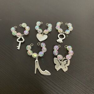Faceted beads and silver tone wine charms. Purse charms.